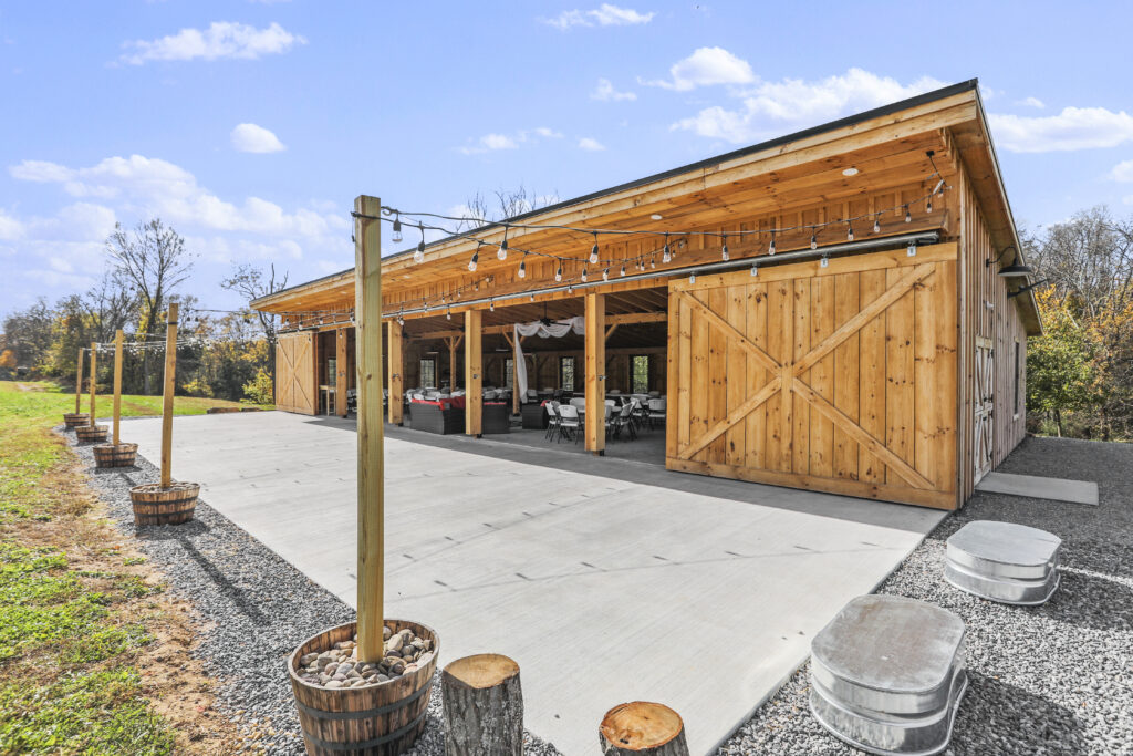 Elegance in the Monoslope Timber Frame Barn
Our new monoslope timber frame pole barn adds a layer of sophistication to all Anniversary Parties Clear Spring Maryland Barn Rental. Built by local craftsmen, the barn features soaring ceilings and warm wood tones that create an immediate sense of celebration. Whether it is a 10th or a 50th anniversary, being the Best Barn Rental in Washington County Maryland means providing a facility that honors the significance of the occasion. The Event Venue in Washington County Maryland is designed to host everything from formal dinners to lively dances.