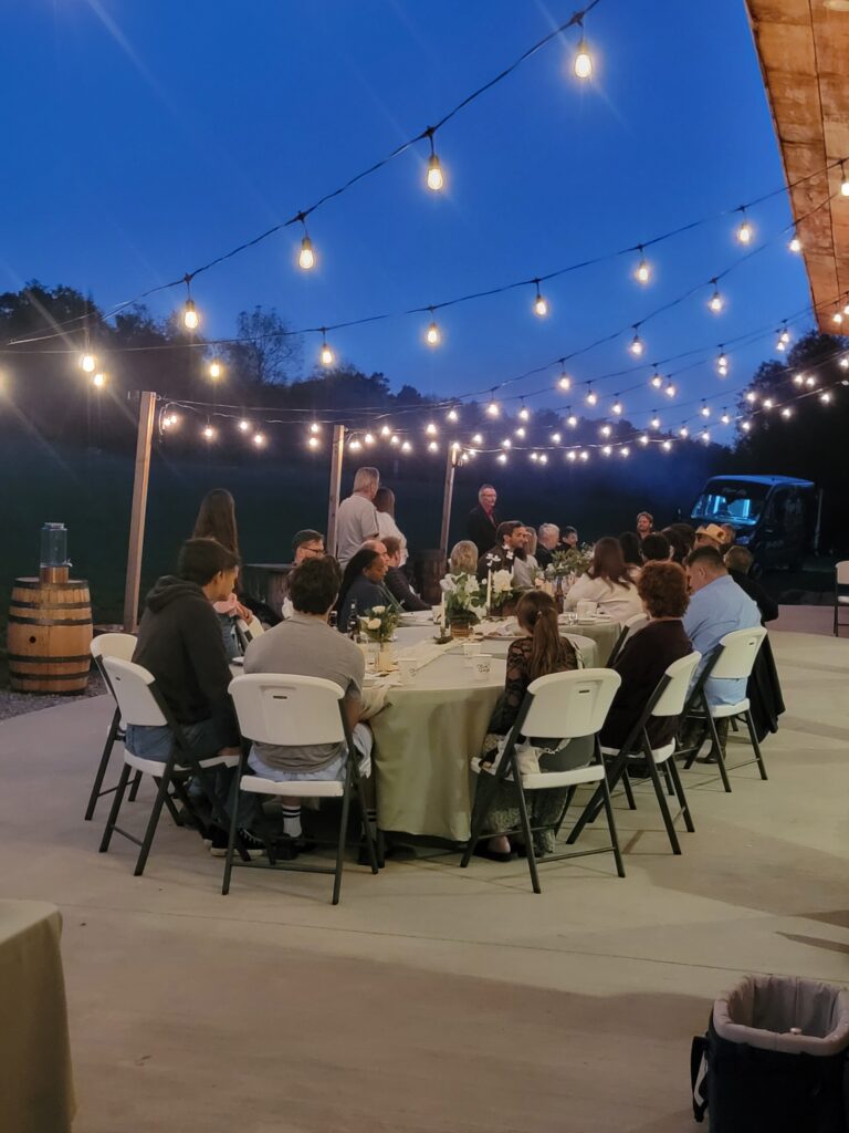 Sunset Toasts on the Venue Patio
A favorite feature for Anniversary Parties Clear Spring Maryland Barn Rental is the spacious patio at the venue building. This outdoor space is perfect for a sunset toast or a cocktail hour. As the Best Barn Rental in Washington County Maryland, we know that guests appreciate the ability to move between the elegant indoor barn and the fresh air of the patio. With views of our rolling infinity fields and the distant Potomac River woodline, the patio provides a picturesque setting for family memories.