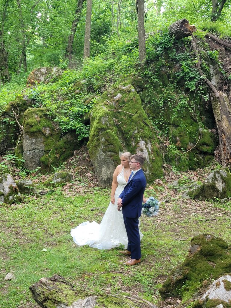 All-Natural Backdrops, Unfiltered Beauty: Say goodbye to elaborate decorations when nature has already provided the most stunning artistry. The natural textures of the forest, the vibrant greens of the foliage, the moss covered boulders, and the organic flow of the landscape create a living, breathing canvas for your wedding. Every angle offers a picturesque scene, ensuring your memories are as breathtaking as the surroundings. This is especially appealing for couples exploring rustic wedding themes and ideas.