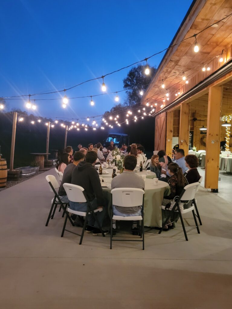 The Versatility of an Elegant Patio
Our expansive patio is a game-changer for event flow. Whether it is used for a sun-drenched cocktail hour or an evening of dancing under the stars, having a dedicated outdoor hardscape adds a layer of luxury to any Barn Wedding Venue. It provides a solid, level surface for guests in heels while keeping everyone immersed in the fresh mountain air.