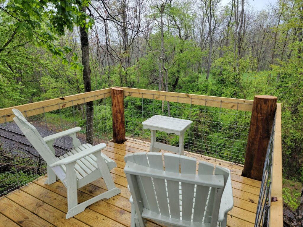 Wedding Venue Tour ⭐5. The Iconic Railroad Overlook 🚂
For many couples, the highlight of their Wedding Venue Tour is the Railroad Overlook. This historic vantage point offers a dramatic backdrop for photos that you simply won't find at any other Barn Wedding location. Looking out over the tracks and the valley provides a sense of timelessness. Seeing this spot in person during your Wedding Venue Tour helps you and your photographer plan those "hero" shots that will hang on your walls for fifty years.