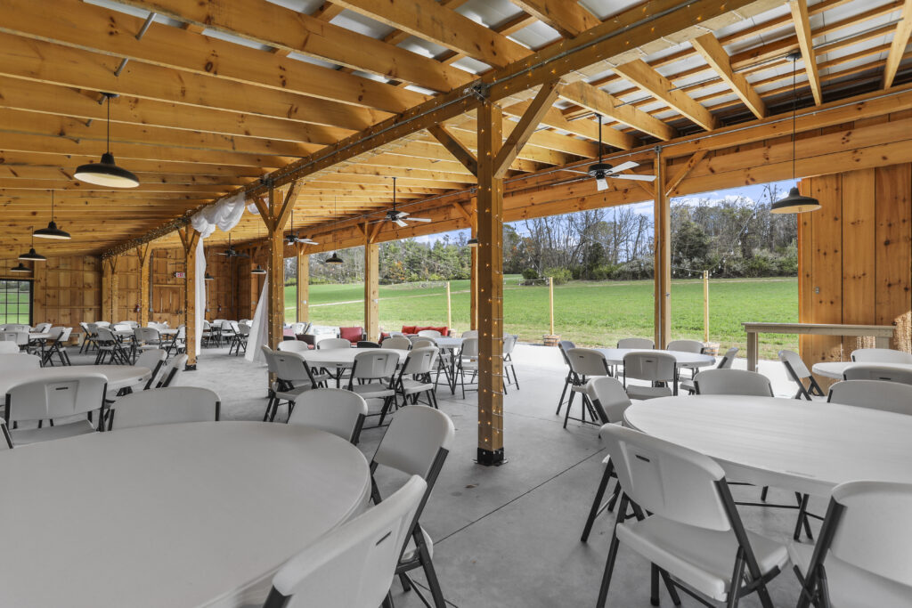 4. Modern Timber Frame Craftsmanship
While we honor the past, the Timber Valley Farm Wedding Venue is a modern timber frame masterpiece. Only two years old, it was built to capture the soaring ceilings and wood-scented warmth of a classic barn but with the structural integrity and pristine finish of new construction. The timber frame method is itself an ancient craft, using heavy timbers joined together with traditional joinery. This creates a sense of "sturdy elegance" at the Timber Valley Farm Wedding Venue that feels permanent—much like the commitment you are making on your wedding day.