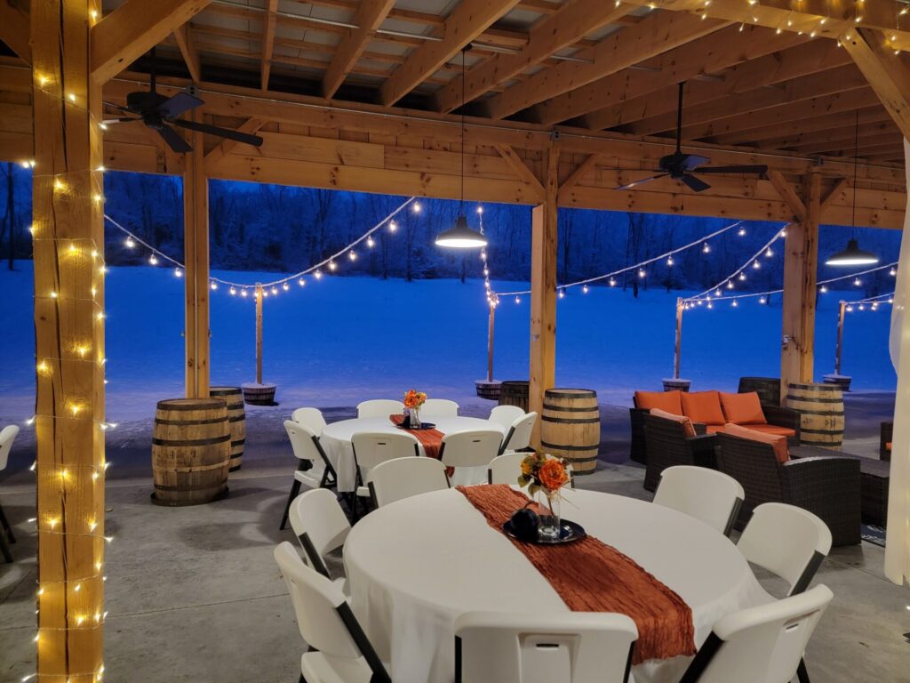 Guests enjoy the warm atmosphere during Snow at Timber Valley while looking out from Timber Valley Farm Barn Rental onto the peaceful snow-covered countryside.