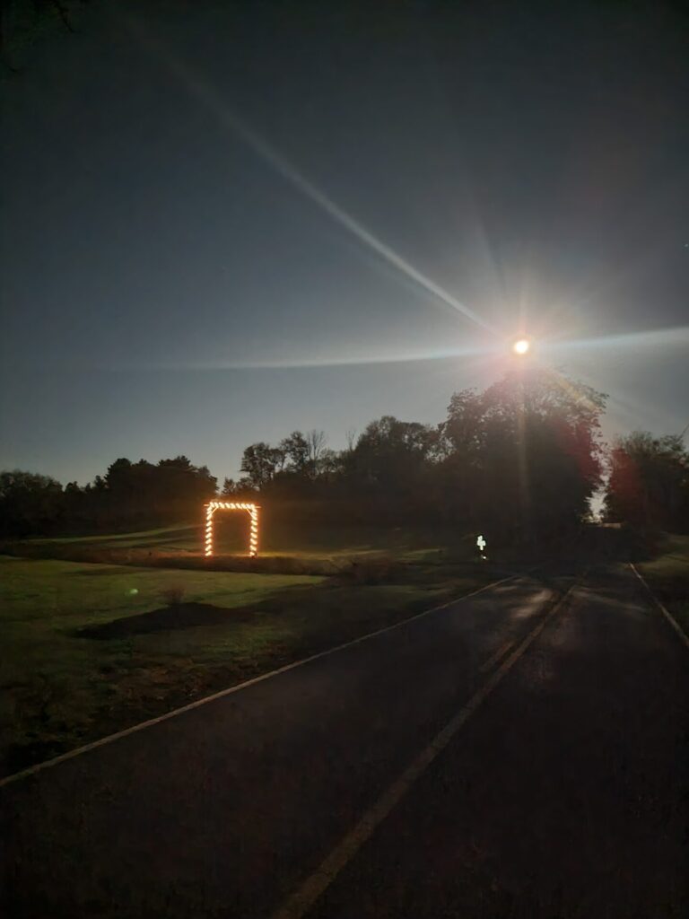 Moonlight shines over the entrance road at Timber Valley Farm Barn Rental during Moonlit Nights at Timber Valley, creating a beautiful Maryland Moonlight Photography scene.