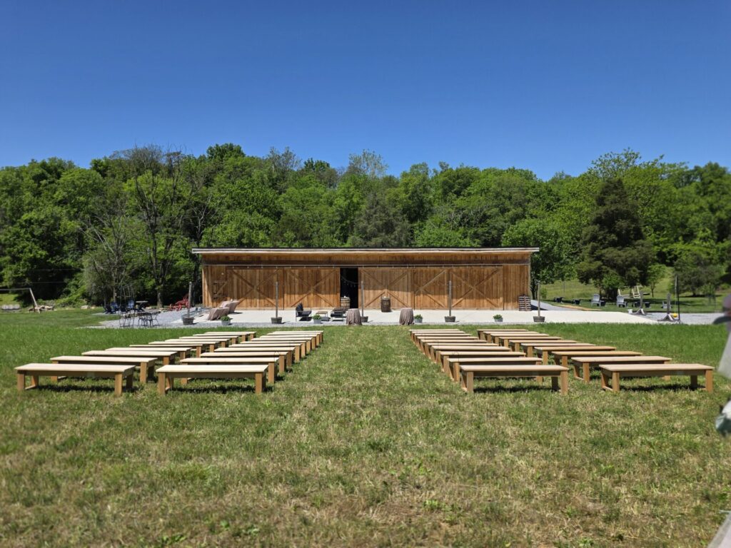 Wedding ceremony benches prepared for Wedding Ceremony Planning at Timber Valley Farm Barn Rental in Clear Spring, Maryland before guests arrive.