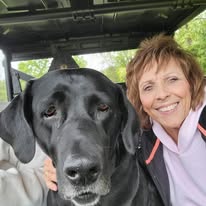 Karen and Joey sharing a special moment at Timber Valley Farm Barn Rental, where Friendly Farm Dogs are part of everyday life on a Maryland farm.