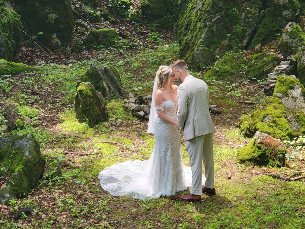 Bride and groom sharing a quiet moment in God's Cathedral at Timber Valley Farm Barn Rental during their wedding in Clear Spring, Maryland.