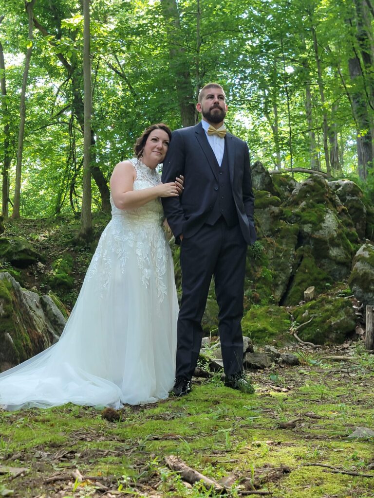 Bride and groom posing for wedding portraits during Wedding Ceremony Planning at God's Cathedral at Timber Valley Farm Barn Rental in Clear Spring, Maryland.
