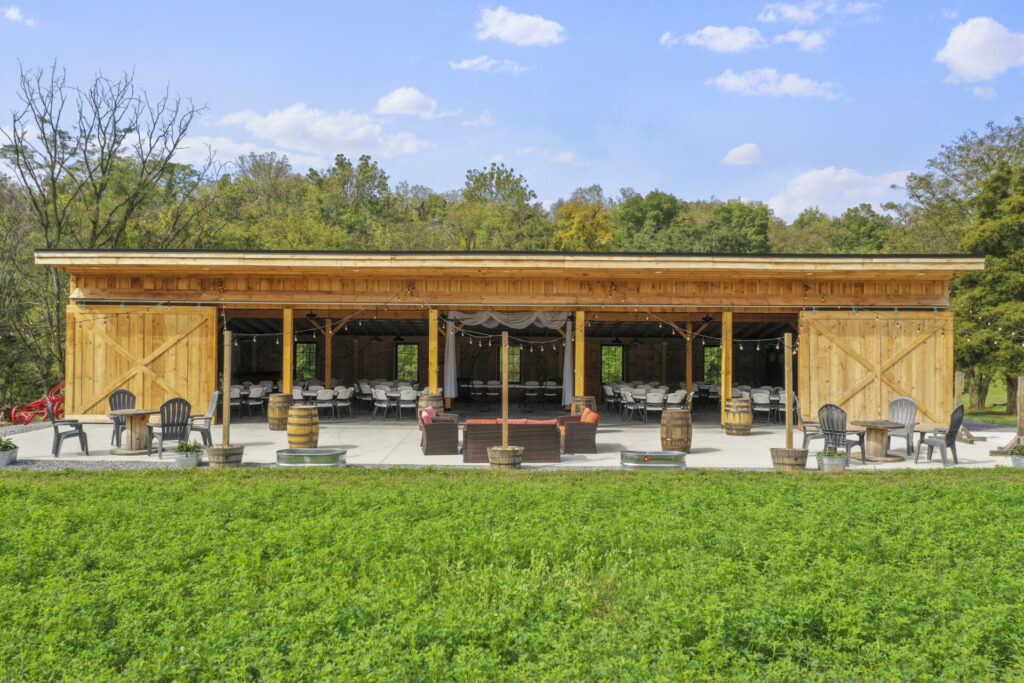 Western Maryland Wedding Venue with timber-frame barn, outdoor patio, lawn, and connected gathering spaces at Timber Valley Farm Barn Rental