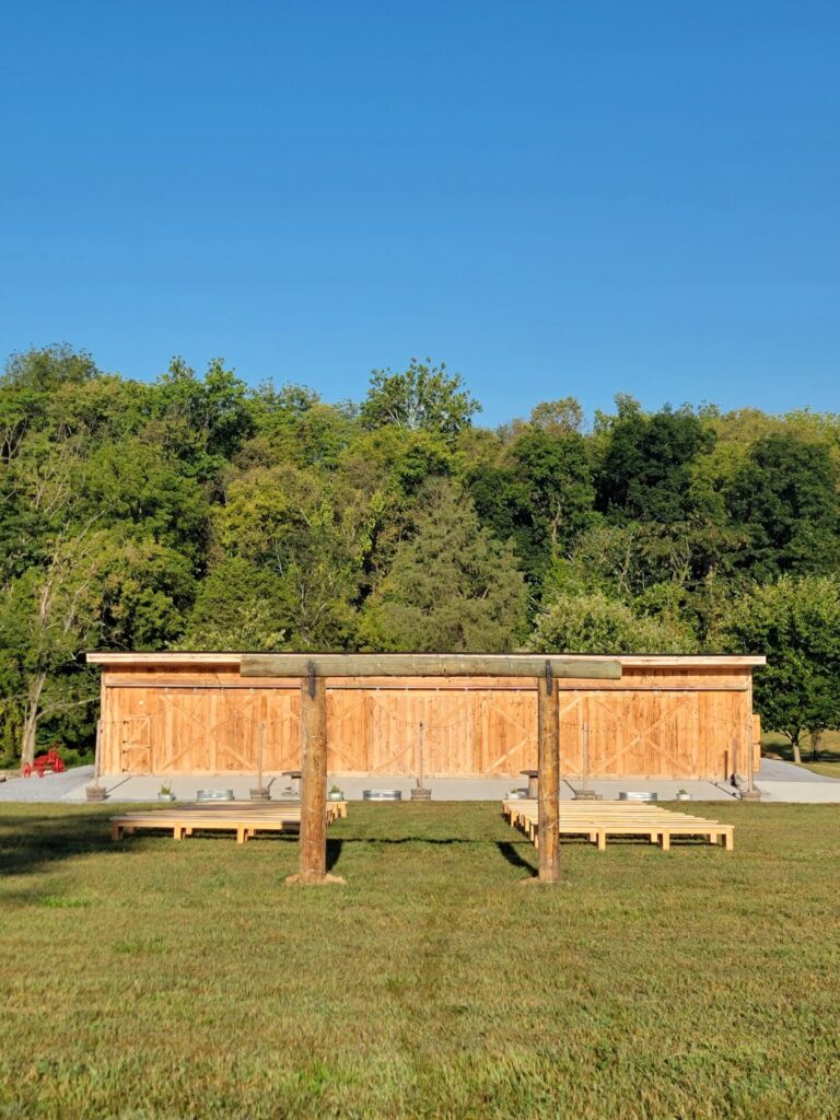 Wedding Ceremony Benches surrounding the Wedding Ceremony Arbor at Timber Valley Farm Barn Rental in Clear Spring, Maryland.