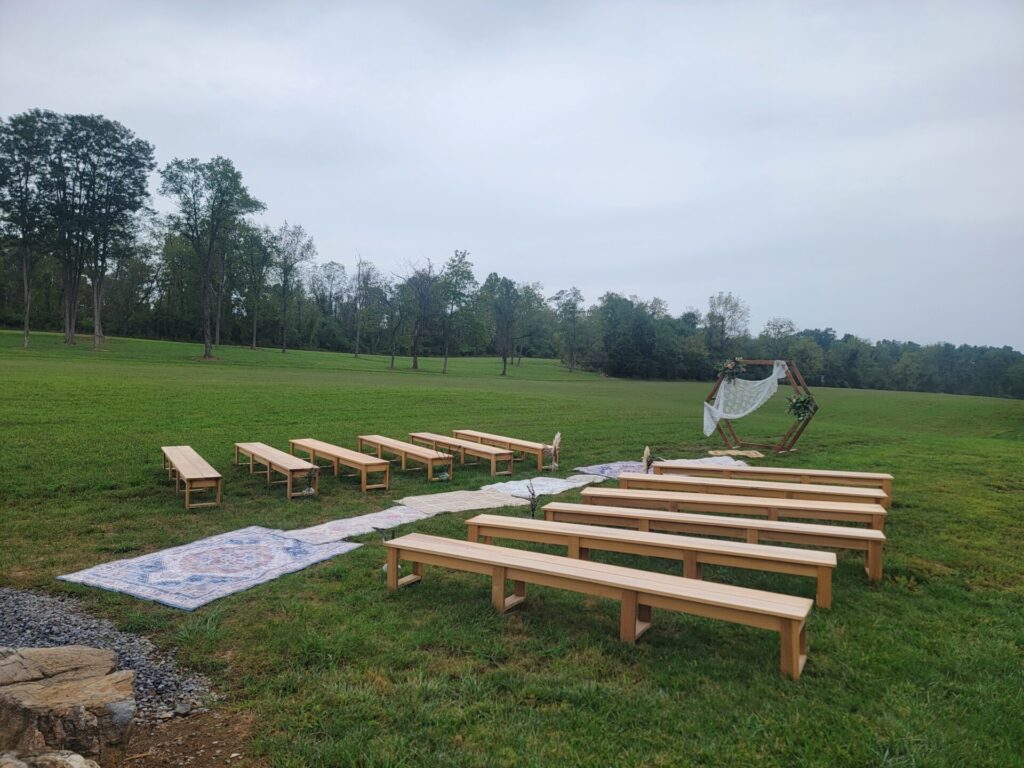 Outdoor Wedding Benches arranged for a custom outdoor wedding ceremony at Timber Valley Farm Barn Rental in Clear Spring, Maryland.