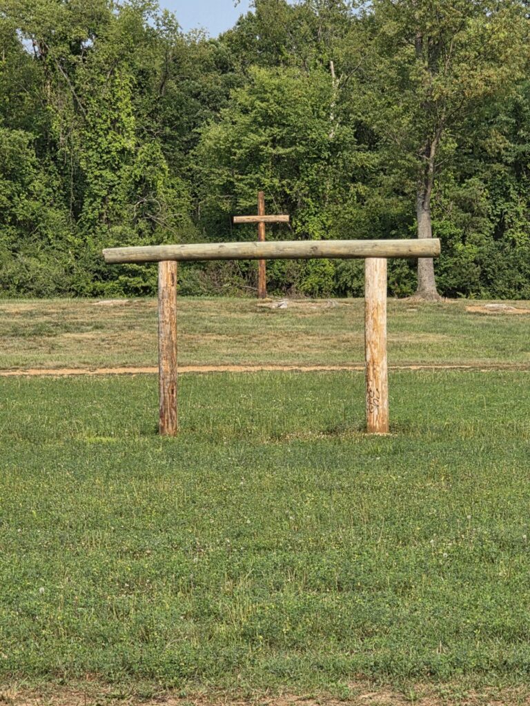 Handcrafted timber Wedding Ceremony Arbor overlooking the outdoor ceremony lawn at Timber Valley Farm Barn Rental in Clear Spring, Maryland.