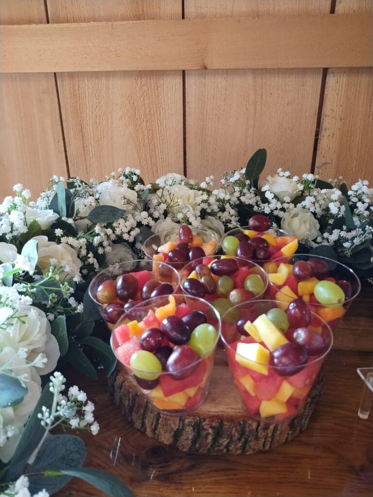 Wedding Guest Experience Maryland with individual cups of fresh fruit arranged for guests at a Timber Valley Farm Barn Rental wedding reception