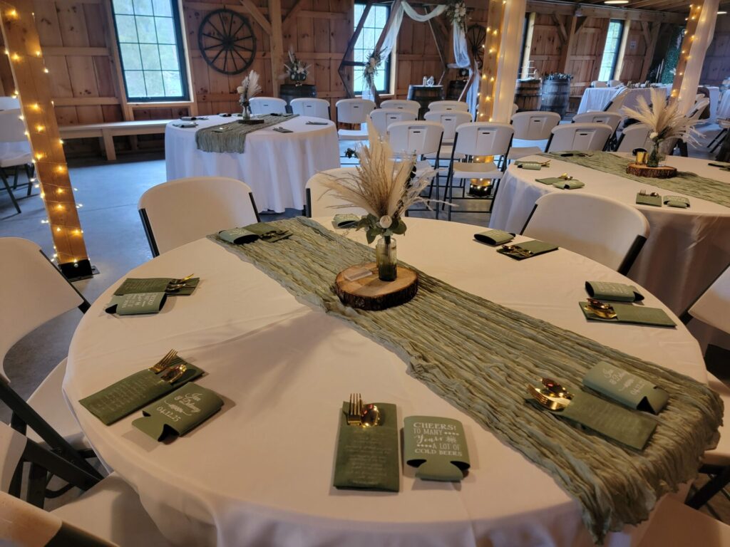 Outdoor Wedding Reception ideas featuring beautifully decorated reception tables inside the handcrafted timber frame barn at Timber Valley Farm Barn Rental in Clear Spring, Maryland.