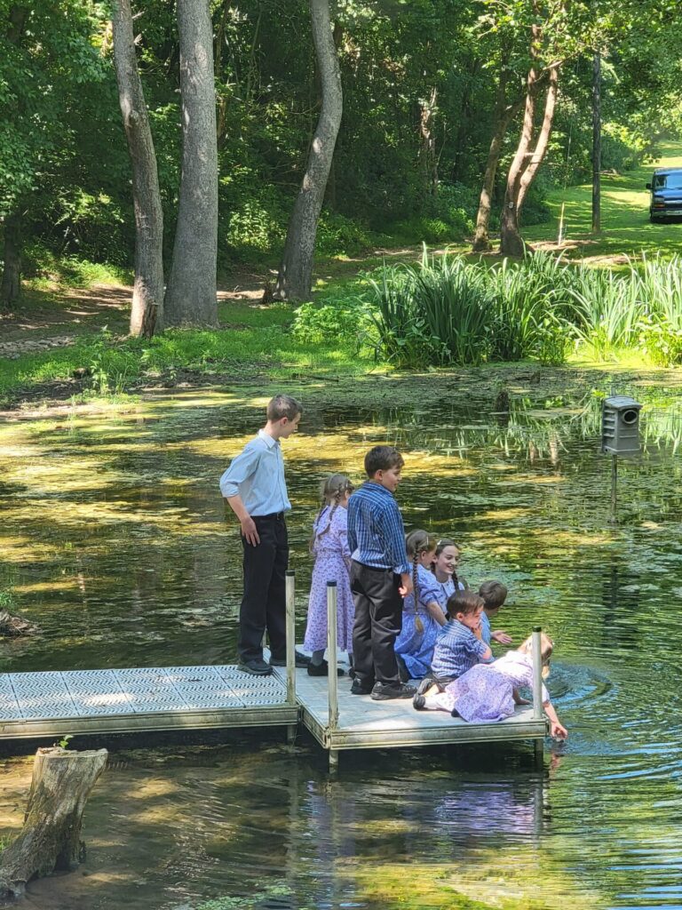 Family enjoying the spring-fed pond at a Western Maryland photography location in Clear Spring, Maryland