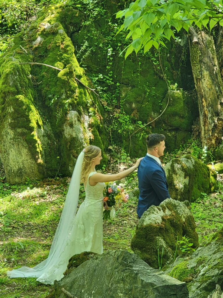 Wedding Ceremony Tips featuring a bride and groom sharing their first look in God's Cathedral at Timber Valley Farm Barn Rental before their outdoor wedding ceremony in Clear Spring, Maryland.