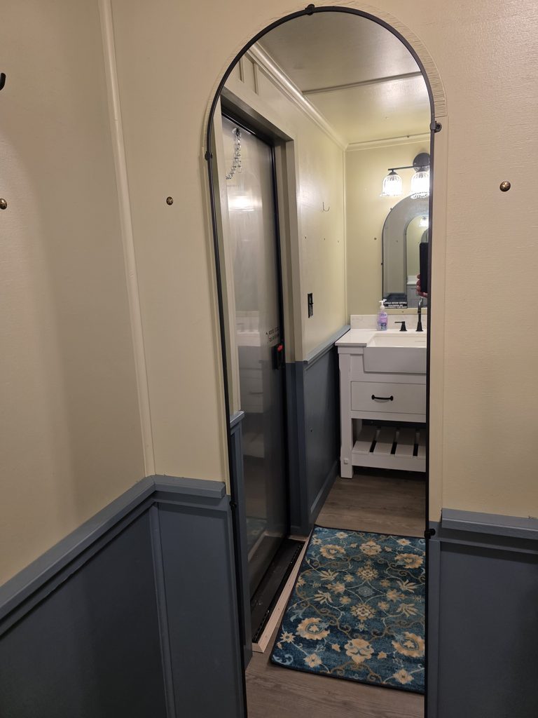 Full-length mirror inside the luxury restroom trailer available for weddings and special events at Timber Valley Farm Barn Rental in Clear Spring, Maryland