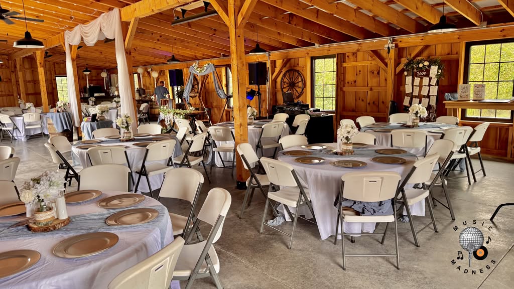 Wedding reception setup at Timber Valley Farm Barn Rental in Maryland featuring Music Madness